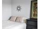 Close up of double bed with patterned pillows, artwork, and black wood dresser at 4226 S Eldridge St # 207, Morrison, CO 80465