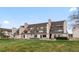 Exterior view of multiple townhomes and green lawn at 4226 S Eldridge St # 207, Morrison, CO 80465