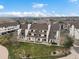 An aerial shot of the townhouse community showing the landscaping, parking, and building layout at 4226 S Eldridge St # 207, Morrison, CO 80465