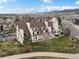 A charming home is surrounded by green grass and tall trees at 4226 S Eldridge St # 207, Morrison, CO 80465