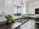 Bright kitchen with updated fixtures and a garden view from the window at 4226 S Eldridge St # 207, Morrison, CO 80465