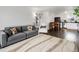 Well-lit living room with a large rug, and an open floor plan connecting to the dining and kitchen areas at 4226 S Eldridge St # 207, Morrison, CO 80465
