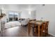 Bright open-concept living space with dining area, fireplace, and sliding glass doors at 4226 S Eldridge St # 207, Morrison, CO 80465