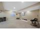 Spacious basement recreation area with room for a home gym and piano at 8430 S Oak St, Littleton, CO 80127