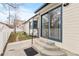 Inviting backyard with sliding glass door, concrete patio, and manicured lawn at 3355 S Emerson St, Englewood, CO 80113