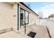 Backyard featuring a concrete patio, steps, and a sliding glass door at 3355 S Emerson St, Englewood, CO 80113
