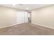 Finished basement bedroom with neutral walls, carpeting, and closet with sliding doors at 3355 S Emerson St, Englewood, CO 80113