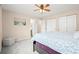Spacious bedroom with plush carpet, ensuite bathroom, and large closet doors at 3355 S Emerson St, Englewood, CO 80113