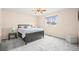 Comfortable bedroom with neutral tones, soft carpet, and a ceiling fan at 3355 S Emerson St, Englewood, CO 80113