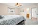 Cozy bedroom with soft carpet, ceiling fan, and bathroom entrance at 3355 S Emerson St, Englewood, CO 80113