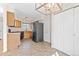 Functional kitchen showcasing neutral countertops, wood cabinets, and updated appliances at 3355 S Emerson St, Englewood, CO 80113