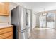Eat-in kitchen featuring stainless steel refrigerator and access to back yard at 3355 S Emerson St, Englewood, CO 80113