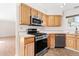 Well-equipped kitchen featuring stainless steel appliances and ample cabinetry at 3355 S Emerson St, Englewood, CO 80113