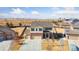 Bright and airy aerial view of a 2-story home in an open field, complete with a three-car garage at 15507 Quince Cir, Thornton, CO 80602
