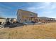 A view of the home's backyard featuring a well-kept lawn, patio, and pergola at 15507 Quince Cir, Thornton, CO 80602