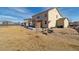 Spacious backyard featuring a patio area, fire pit, and ample space for entertaining and enjoying outdoor activities at 15507 Quince Cir, Thornton, CO 80602