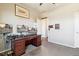 Bright bedroom featuring a desk with dual monitors, complemented by an open closet at 15507 Quince Cir, Thornton, CO 80602