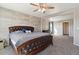 Large bedroom features a sizable carpeted area and a wood-paneled wall behind a king-size bed at 15507 Quince Cir, Thornton, CO 80602