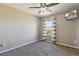 This bright bedroom has neutral colored walls, carpet, and a large window with curtains at 15507 Quince Cir, Thornton, CO 80602