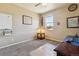 Cozy bedroom with a ceiling fan, and a window letting in plenty of natural light at 15507 Quince Cir, Thornton, CO 80602
