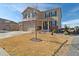 Traditional two-story home with a brick-accented facade, attached garage, and well-manicured front yard at 15507 Quince Cir, Thornton, CO 80602