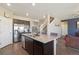 Spacious kitchen with a large island, stainless steel appliances, and sleek cabinetry at 15507 Quince Cir, Thornton, CO 80602