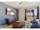 Relaxing living room featuring a large flat screen television and comfortable leather sofa at 15507 Quince Cir, Thornton, CO 80602