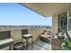 Cozy outdoor balcony with skyline views, lounge seating and dining area at 601 W 11Th Ave # 815, Denver, CO 80204