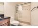Bathroom featuring glass shower, dark countertops, vanity with wood cabinets, and a white toilet at 601 W 11Th Ave # 815, Denver, CO 80204