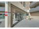 Entrance with glass doors and signage, along with parking restrictions posted at 601 W 11Th Ave # 815, Denver, CO 80204