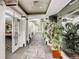 Hallway view with access to the clubhouse, theatre, and dining area with planted accent décor at 601 W 11Th Ave # 815, Denver, CO 80204