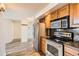 Well-equipped kitchen with stainless steel appliances and wood cabinets at 601 W 11Th Ave # 815, Denver, CO 80204