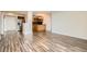 Open-concept living area featuring hardwood floors, a kitchen, and access to a balcony at 601 W 11Th Ave # 815, Denver, CO 80204