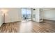 Bright living room with hardwood floors and a sliding glass door leading to a balcony with views at 601 W 11Th Ave # 815, Denver, CO 80204