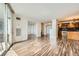 Open-concept living area featuring hardwood floors, a kitchen, and access to a balcony at 601 W 11Th Ave # 815, Denver, CO 80204