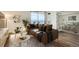 Staged living room with contemporary furnishings, hardwood floors, and views from the balcony at 601 W 11Th Ave # 815, Denver, CO 80204