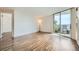 Bright living room with hardwood floors and a sliding glass door leading to a balcony with views at 601 W 11Th Ave # 815, Denver, CO 80204