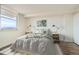 Bright main bedroom with modern décor, side tables, and comfortable queen bed at 601 W 11Th Ave # 815, Denver, CO 80204