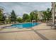 Inviting outdoor pool with surrounding lounge chairs and lush landscaping in an apartment complex at 601 W 11Th Ave # 815, Denver, CO 80204