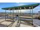 Community rooftop deck with awning and table seating boasting expansive city views at 601 W 11Th Ave # 815, Denver, CO 80204