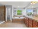 Spacious bathroom with double sinks, large soaking tub, and separate glass enclosed shower at 24682 E Ontario Dr, Aurora, CO 80016