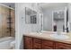 Bathroom featuring a glass enclosed shower, double sinks, and well lit mirrors at 24682 E Ontario Dr, Aurora, CO 80016