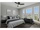 Modern bedroom with plenty of natural light from the large shuttered windows and contemporary decor at 24682 E Ontario Dr, Aurora, CO 80016