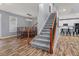 Open dining room with a staircase and views of the modern kitchen at 24682 E Ontario Dr, Aurora, CO 80016