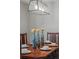 Close-up of a dining table set with plates and decorative centerpieces at 24682 E Ontario Dr, Aurora, CO 80016