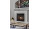 Inviting fireplace with white subway tile surround and hearth beneath a gray mantle at 24682 E Ontario Dr, Aurora, CO 80016