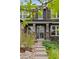 Inviting home entrance with stone accents, manicured shrubs, and an address marker at 24682 E Ontario Dr, Aurora, CO 80016