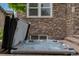 Hot tub surrounded by stone facade, offering a relaxing outdoor experience with a stone wall backdrop at 24682 E Ontario Dr, Aurora, CO 80016