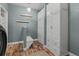 Functional laundry room featuring ample storage cabinets and a modern washer and dryer at 24682 E Ontario Dr, Aurora, CO 80016