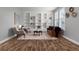 Neutral living room featuring hardwood floors, custom built-ins, and natural light at 24682 E Ontario Dr, Aurora, CO 80016
